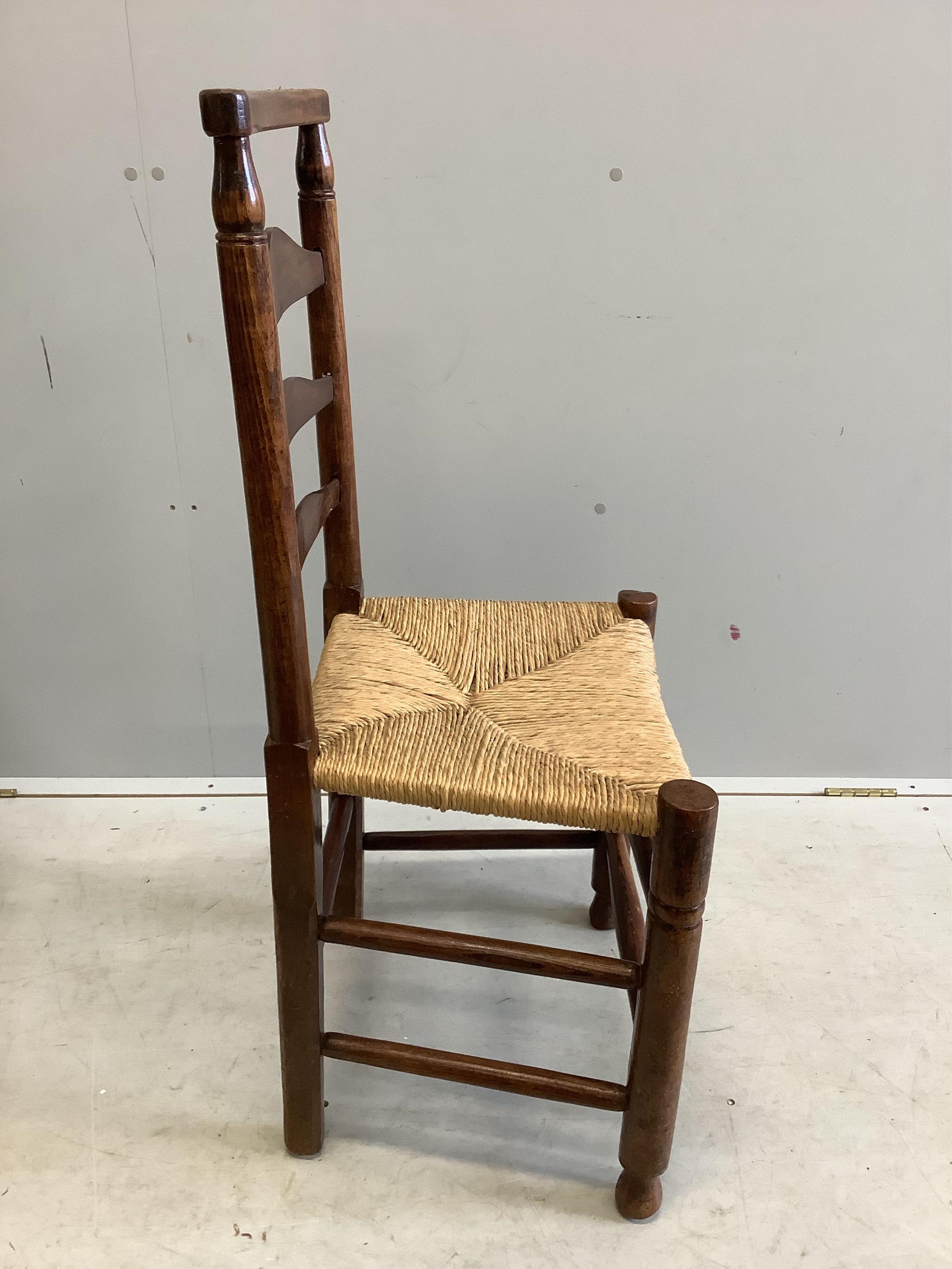 A set of four 19th century ash ladderback rush seat dining chairs. Condition - fair